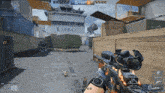 a person is holding a rifle in a video game with a ship in the background