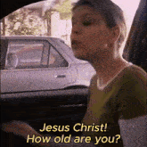 a woman sitting in a car talking to jesus christ