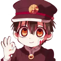 a boy in a hat is giving the ok sign