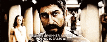 a man with a beard says you are a winner andres this is sparta .