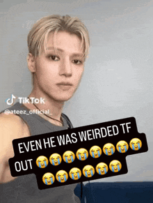 a young man with tears on his face and the caption even he was weirded tf