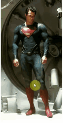a man in a superman costume is standing in a doorway