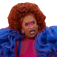 a drag queen with red hair and purple lipstick is wearing a pink and blue dress
