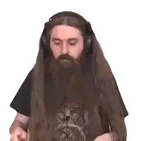 a man with a long beard is wearing headphones