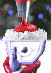 a pixel art drawing of a cup with red frosting on top