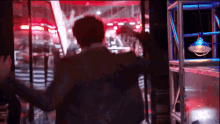 a blurry picture of a man in a suit standing in a room