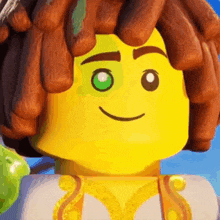 a close up of a lego man 's face with a green eye .