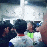 a man wearing an o'neal shirt is standing in a crowd