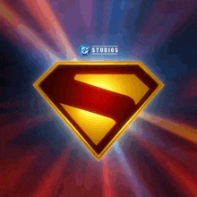 a superman logo with studios written on the bottom right