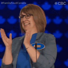 a woman applauds while wearing a name tag that says ' sheri '