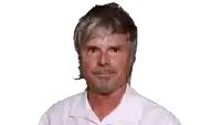 a man with gray hair and a beard is making a face