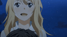 a girl with blonde hair and black eyes looks at a man