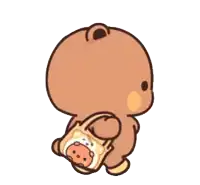 a brown teddy bear is holding a bag with a bear on it .