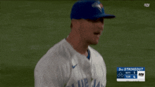 a blue jays pitcher throws a pitch in the 3rd inning of a baseball game