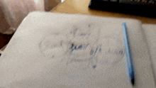 a piece of paper with the word thank you written in blue marker
