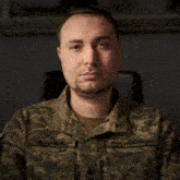 a man in a military uniform has the name budanov on the sleeve