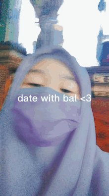 a girl wearing a blue hijab with the words date with bal < 3 written on it