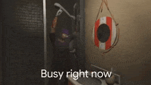 a man in a bathroom with the words busy right now on the bottom