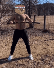 a shirtless man wearing a lion headband holds a stick