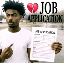 a man is holding a job application with a broken heart on it