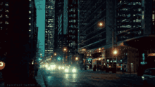 a blurred image of a city street at night with neontext tumblr.com written on the bottom