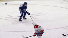 a hockey game is being played in front of a sn logo