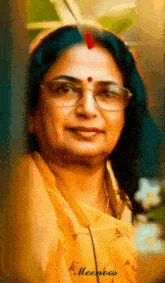 a close up of a woman wearing glasses and a yellow dress .