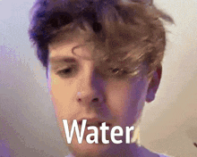 a close up of a man 's face with the word water written on the bottom