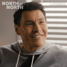 a close up of a man 's face with the words north of north on the top