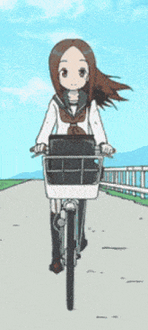 a girl in a school uniform is riding a bicycle down a road