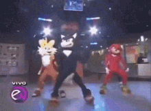 sonic the hedgehog tails and knuckles are dancing in a disco
