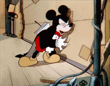 a cartoon of mickey mouse holding a piece of paper in his hand
