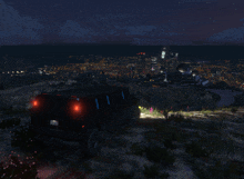a black limousine is parked on a hill with a view of a city at night