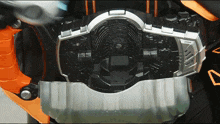 a close up of the inside of a machine with the letter a on the bottom