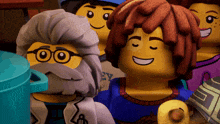 a group of lego characters including a man with glasses and a beard