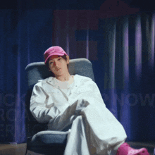a person sitting in a chair with their arms outstretched