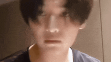 a close up of a man 's face with his eyes closed .
