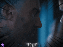 a blurry picture of a man 's face with the words ' slaps ' below it