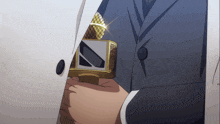 a man in a suit is holding a microphone with a n on it