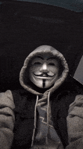 a man wearing a hooded jacket and a mask with a mustache