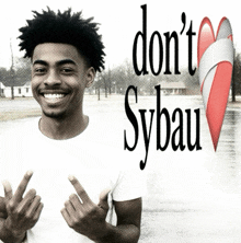 a man giving the middle finger with the words " do n't sybau " behind him