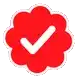 a red flower with a white check mark in the middle .