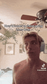 a shirtless man wearing headphones says how i 'd react to these going in my butt