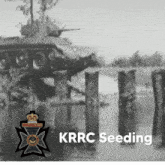 a black and white photo of a tank with the words krrc seeding below it