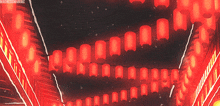 a bunch of red lanterns hanging from the ceiling with madnessmaniac written on the bottom right