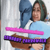 a woman in a hijab is hugging another woman with the words sahabat cakrawala written above them