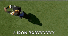 a man in a boston bruins jersey is screaming with his arms outstretched .