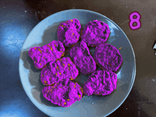 a plate of purple chicken nuggets with the number 8 on the side