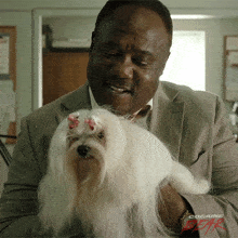 Holding Dog Bob GIF - Holding Dog Bob Cocaine Bear GIFs