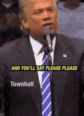 a man in a suit and tie speaking into a microphone with the words " and you 'll say please please townhall " above him
